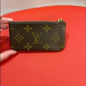 100% authentic Louis Vuitton Monogram coin pouch.
